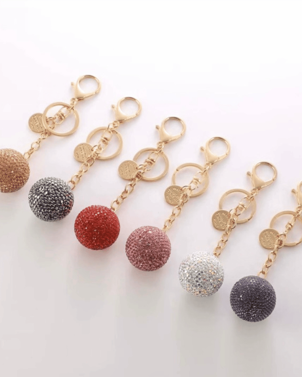 Rhinestone glitter ball keychains in multiple colours on gold chain